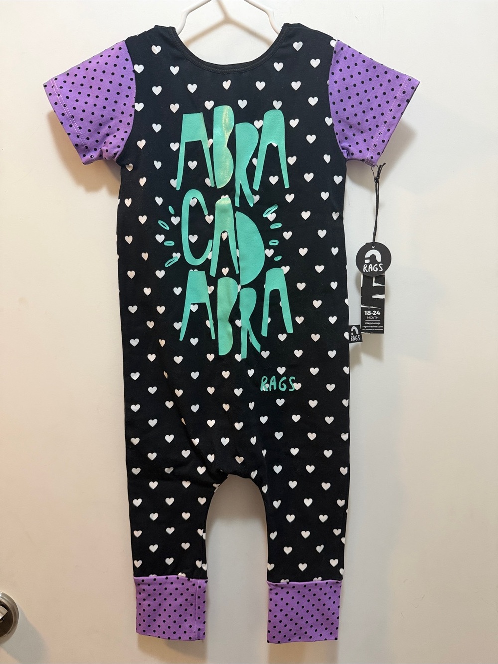 New Rags Black Heart Romper with Teal Lettering & Purple Polka Dot Accents